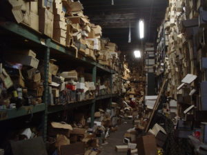 Shelves full of disordered files