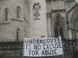 'Undercover is No Excuse for Abuse' banner at the Royal Courts of Justice