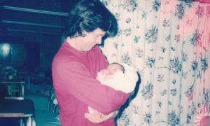 Bob Lambert holds his new born son TBS, September 1985
