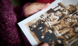 Honor Robson holds a photo of her brother Michael Hartley [pic: Mark Waugh]