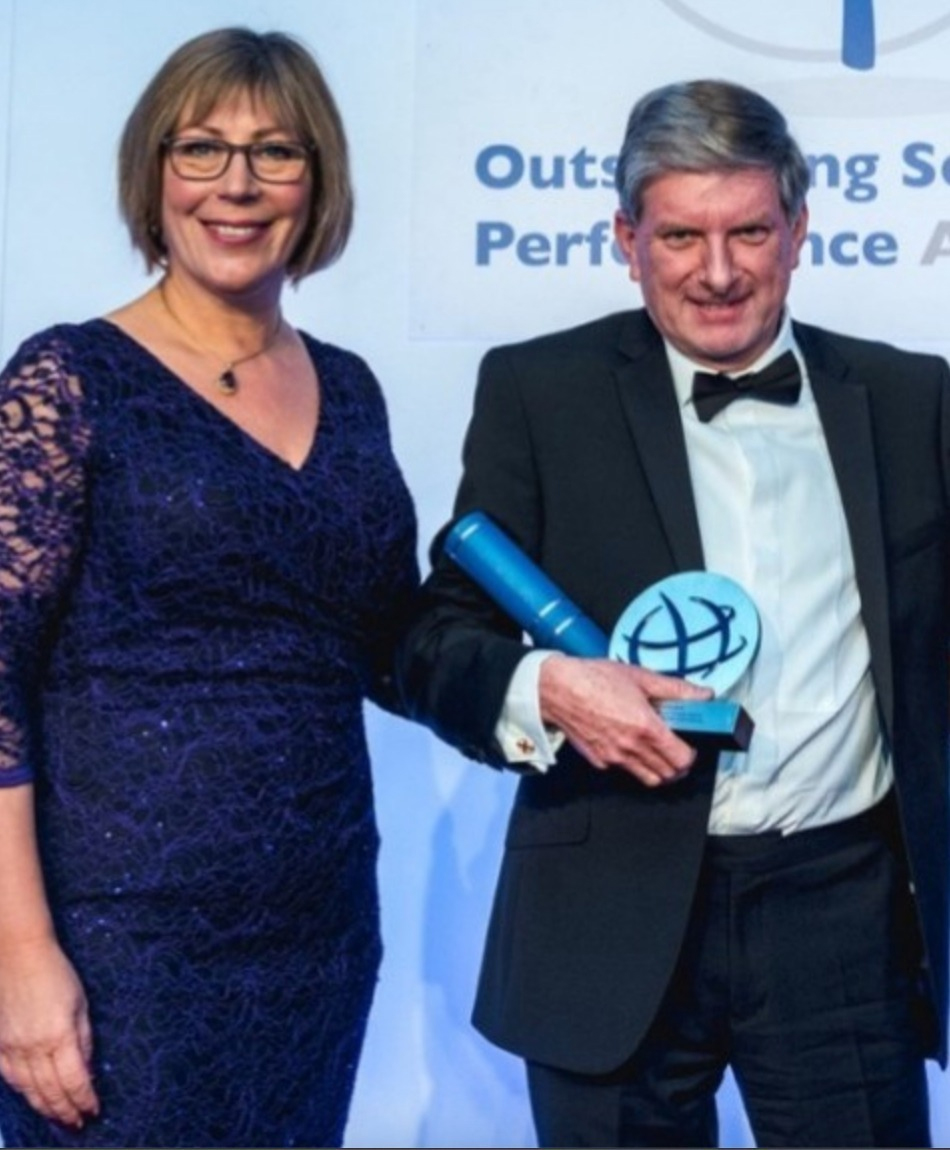 Former Nottinghamshire Assistant Chief Constable Susannah Fish, who authorised deploying Mark Kennedy as a spycop, presents Stephen Beels with a security industry award, c.2019